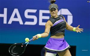 Canadian professional tennis player, Bianca Andreescu returns a serve